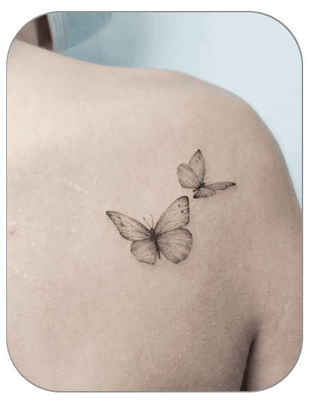 tatuaje mariposas estilo Fineline hecho por Carla en the last gallery tattoo studio Mollet del Vallès, Barcelona, tatuaje femenino